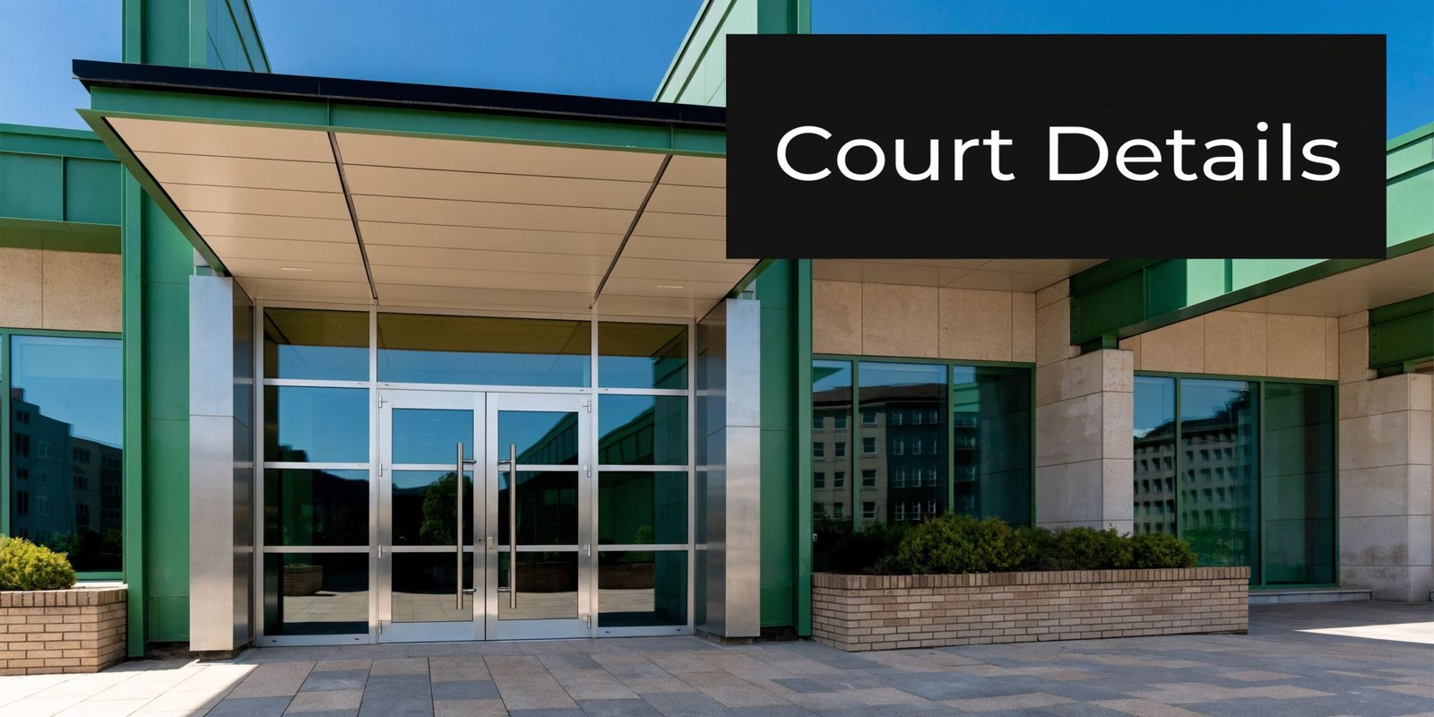 The modern entrance of the Northglenn Municipal Court building in Colorado with glass doors and green accents.